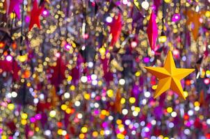 Colorful star ornaments hanging to decorate for Christmas holiday. photo