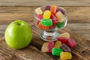 Fruit marmalade sweets, jelly candies on a wooden desk. Fruit natural dessert with sugar photo