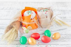 Easter background. Traditional food on the holiday table - Easter Cake and Easter painted eggs. Easter recipe. photo