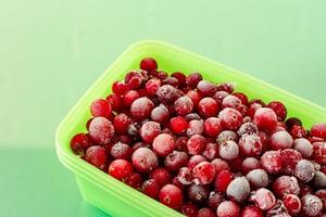 Frozen cranberries. Frozen organic berries for desserts and bakery photo