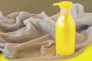 Spa treatment and body care concept in colors of the year 2021 - Illuminating yellow and ultimate grey. photo
