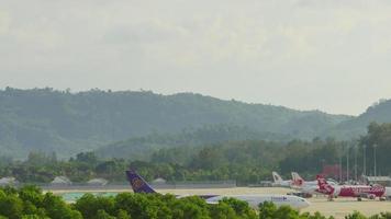 PHUKET, THAILAND NOVEMBER 26, 2019 - Phuket airport traffic. Accelerated daytime airplane footage at Phuket International Airport video