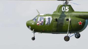 NOVOSIBIRSK, RUSSIAN FEDERATION JULY 28, 2019 - Vintage Helicopter Mi 1 performance aerobatics at Airshow at the Mochische aerodrome UNNM video