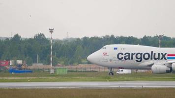 NOVOSIBIRSK, RUSSIAN FEDERATION JUNE 10, 2020 - Boeing 747 LX WCV of Cargolux taxiing after landing at Novosibirsk International Airport video