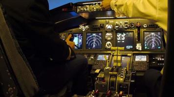 Pilots of passenger aircraft at work. Approaching video