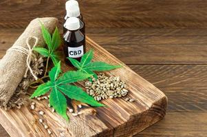 cannabis CBD oil hemp products - capsules and seeds of hemp photo