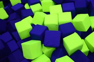 Many colorful soft blocks in a kids' ballpit at a playground photo