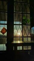 The morning sun shines through the bedroom window at villa bandung indonesia photo