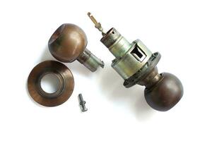 The broken old doorknob and knot isolated on white background included clipping path. photo