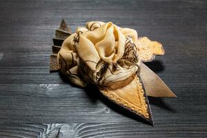 brown leather and silk brooch stylized as flower photo