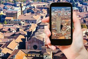 tourist taking photo of center Bologna city