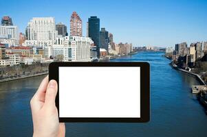 tourist photographs East river in New York photo