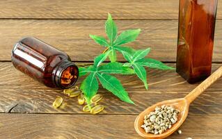 cannabis CBD oil hemp products - capsules and seeds of hemp photo