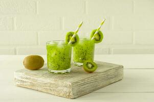 Healthy eating - green vitamin smothie with kiwi vegetables. Detox healthy drink for energhy photo