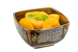 Marinated peaches dish view photo