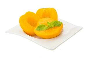 Marinated peaches dish view photo