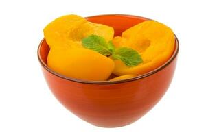 Marinated peaches dish view photo