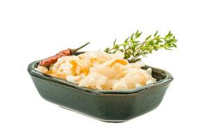 Fermented cabbage in a bowl on white background photo