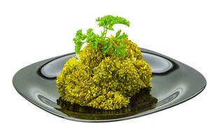 Boiled cauliflower on the plate and white background photo