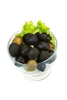 Olives in a bowl on white background photo