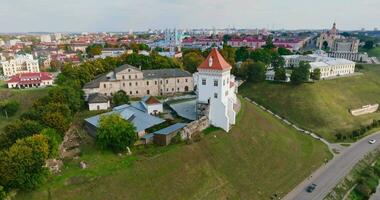 circular flight and aerial panoramic view overlooking the old city and historic buildings of medieval castle near wide river video