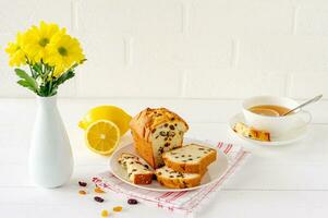Homemade freshly baked cake loaf with raisins. Traditional treat for tea or coffee. Pound cake. Delicious breakfast. photo