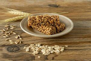 Raw Organic Granola Bars with Seeds and Nuts. Homemade sweet healthy dessert for breakfast photo