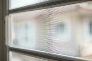 mosquito net wire screen on house window protection against insect photo