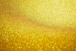 Abstract gold glitter sparkle with bokeh light background photo