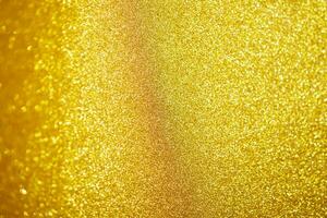 Abstract gold glitter sparkle with bokeh light background photo