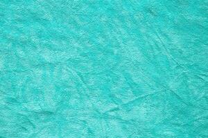 Green towel fabric texture surface close up background photo