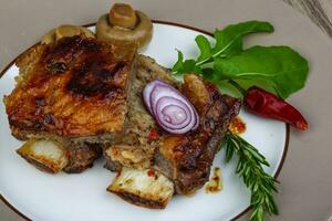 Beef ribs on the plate photo