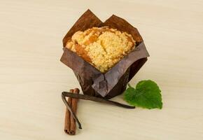 Muffin on wooden background photo