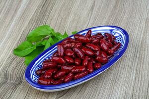 Kidney beans in a bowl on wooden background photo