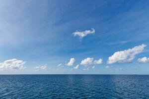 Perfect sky and ocean. Endless seascape, freedom ecology nature concept. Blue sea water. Ocean surface natural background on blue sky. Tropical seaside, horizon, idyllic skyline, tranquil skyscape photo