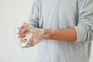 Man wash hands with soap for COVID-19 corona virus prevention concept photo