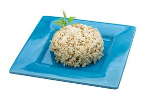 Boiled rice on the plate and white background photo