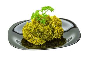 Boiled cauliflower on the plate and white background photo