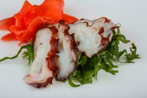 Octopus sashimi on the plate photo