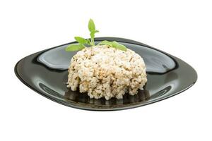 Boiled rice on the plate and white background photo