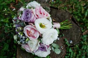 Beautiful tender wedding bouquet and rings. photo