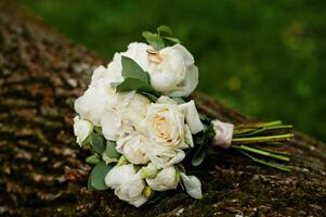 Beautiful tender wedding bouquet and rings. photo