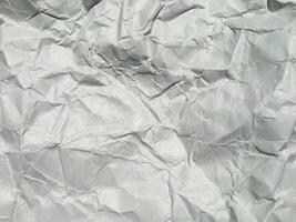 Top view of white crumpled paper texture background. Copy space for design and artwork photo