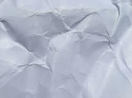 Top view of white crumpled paper texture background. Copy space for design and artwork photo