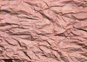 Beautiful pattern of red crumpled paper texture background. photo