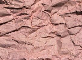 Beautiful pattern of red crumpled paper texture background. photo