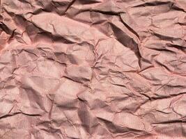 Beautiful pattern of red crumpled paper texture background. photo