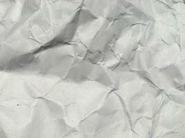 vista superior del fondo de textura de papel arrugado blanco. copie el espacio para el diseño y las ilustraciones foto