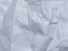 Top view of white crumpled paper texture background. Copy space for design and artwork photo