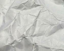 Top view of white crumpled paper texture background. Copy space for design and artwork photo